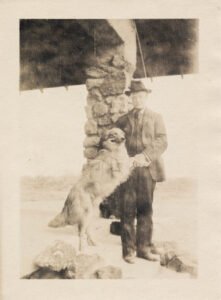 Senior dog standing with its owner, representing muscle loss and mobility in aging dogs